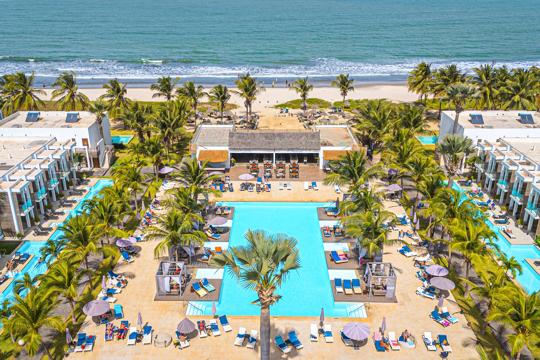 Aerial view of TUI BLUE Tamala showing the beachfront resort, pools, palm trees and Kotu Beach